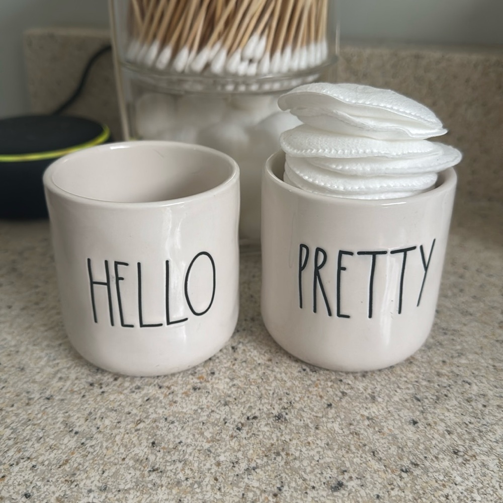 Two ceramic dishes that can be used to hold q-tips, cotton balls, etc.